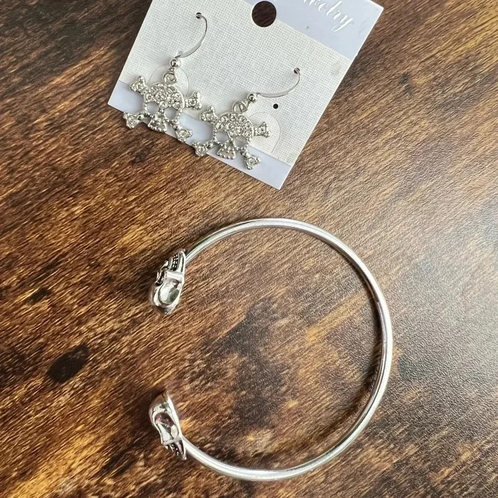 SET: 2 pieces. A skull cuff bracelet + a pair of skull dangly earrings
